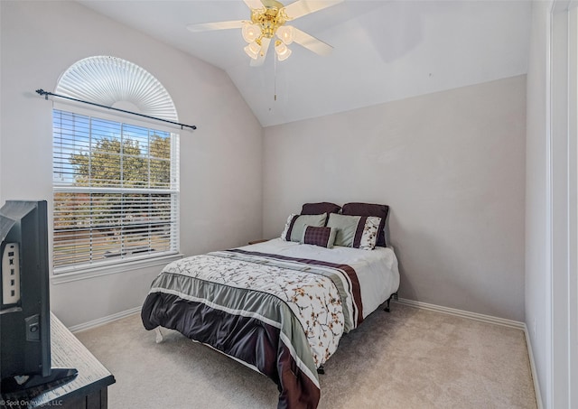 bedroom featuring ceiling fan, light carpet, and lofted ceiling