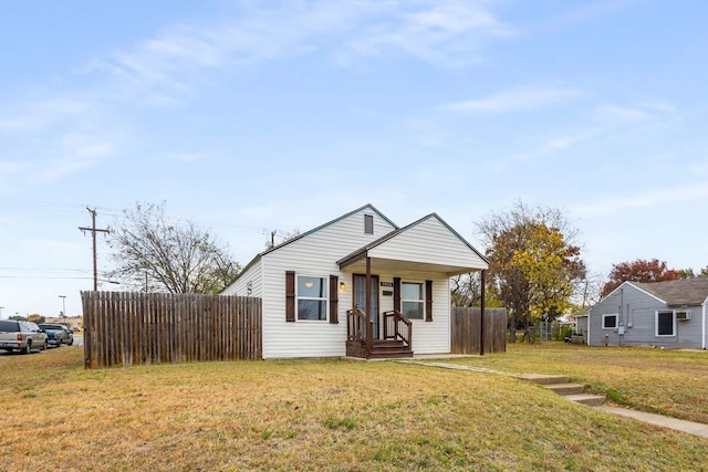 bungalow-style home featuring a front lawn