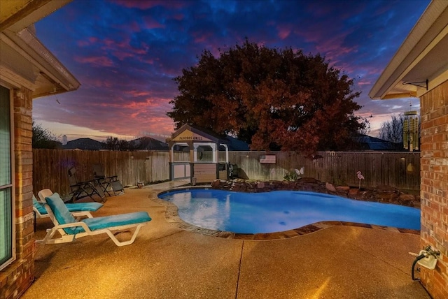 view of pool featuring a gazebo, a fenced backyard, a fenced in pool, and a patio