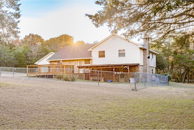 back of property with a wooden deck