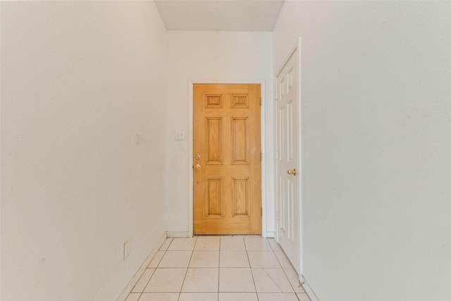 hallway with light tile patterned floors