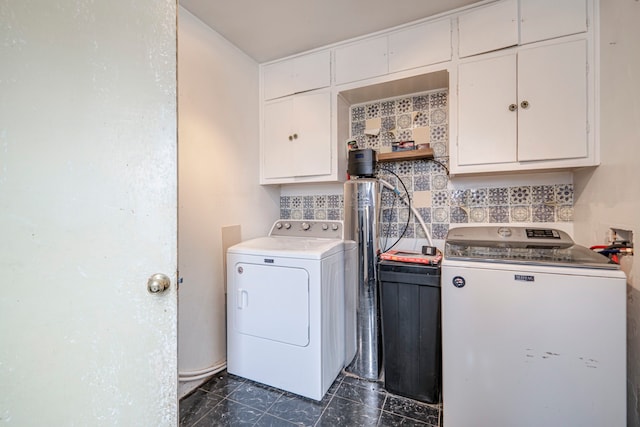 washroom with cabinets and washer and clothes dryer