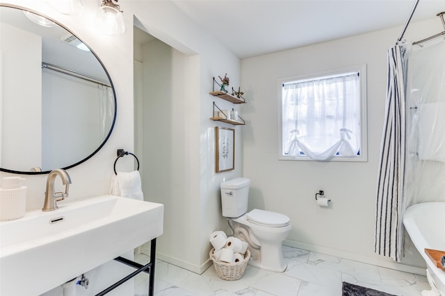 full bathroom with sink, shower / bathtub combination with curtain, and toilet