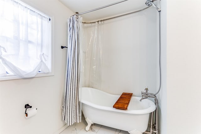 bathroom with shower / bathtub combination with curtain