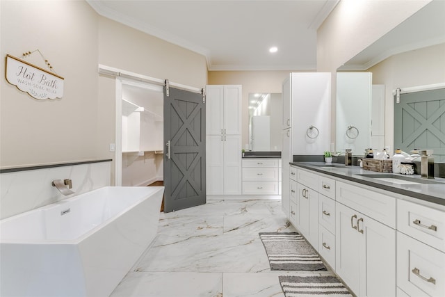 bathroom featuring vanity, crown molding, and a washtub