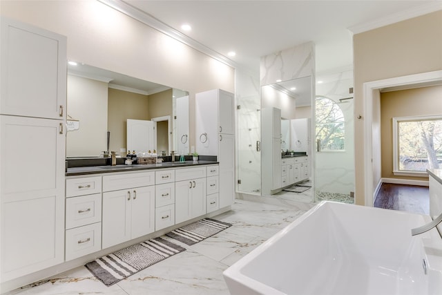 bathroom featuring plus walk in shower, vanity, and ornamental molding