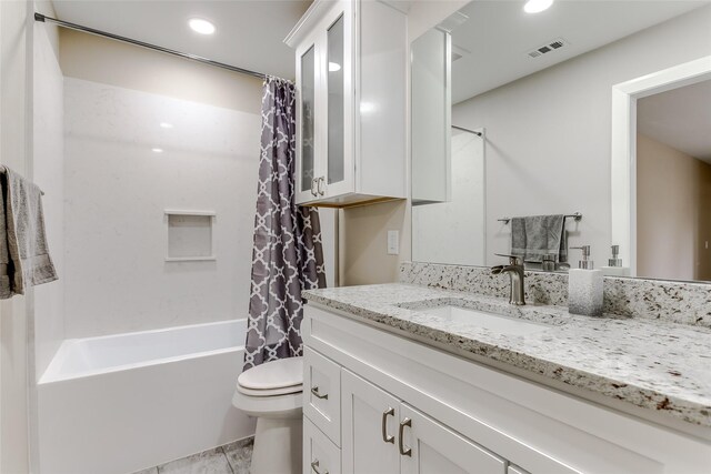 full bathroom featuring vanity, toilet, and shower / bathtub combination with curtain