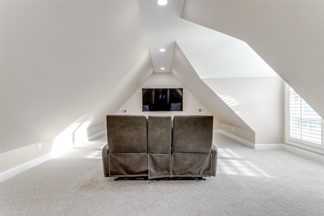 bedroom with carpet floors and vaulted ceiling