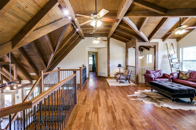 interior space with lofted ceiling with beams, wood ceiling, and hardwood / wood-style flooring