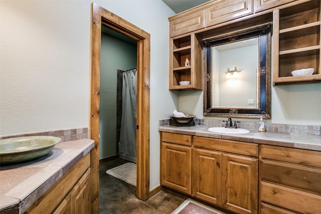 bathroom featuring vanity and a shower with shower curtain