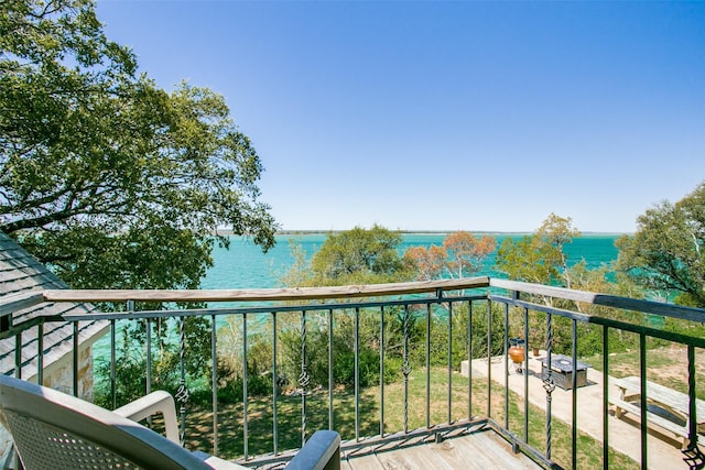 balcony featuring a water view