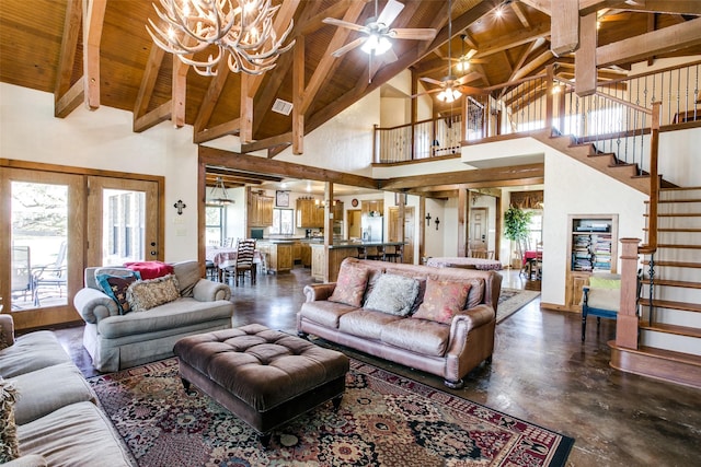 living room featuring beam ceiling, ceiling fan with notable chandelier, high vaulted ceiling, and plenty of natural light