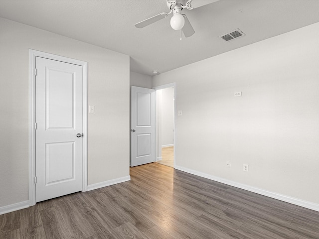 unfurnished bedroom with hardwood / wood-style flooring and ceiling fan