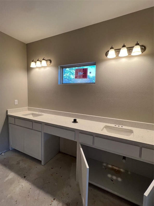 bathroom featuring concrete floors and sink