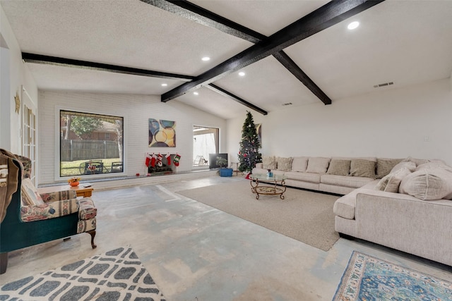 living room with concrete flooring, a textured ceiling, and lofted ceiling with beams