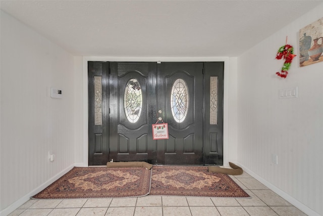 foyer with light tile patterned flooring