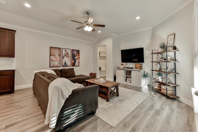 living room with light hardwood / wood-style flooring, ceiling fan, and ornamental molding