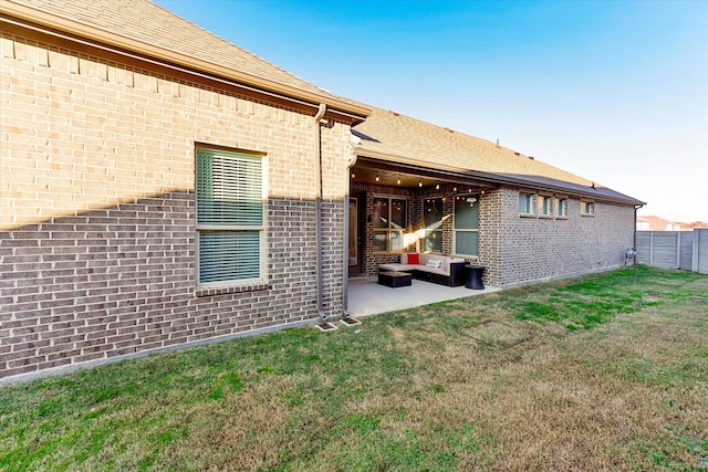 exterior space with a patio area and a yard