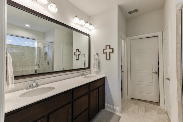 bathroom featuring vanity and a shower with door