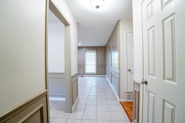 508 Squires Ln, Krugerville, TX 76227 - hallway with visible vents, light tile patterned floors, and a decorative wall