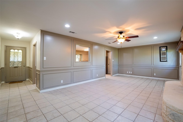508 Squires Ln, Krugerville, TX 76227 - empty room featuring light tile patterned flooring, a decorative wall, a ceiling fan, recessed lighting, and visible vents