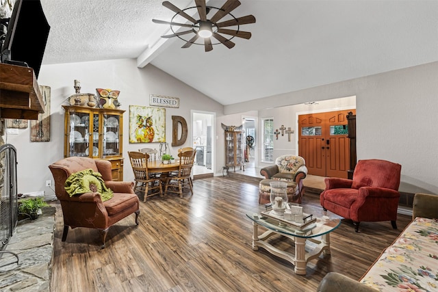 living room featuring a textured ceiling, lofted ceiling with beams, dark hardwood / wood-style floors, and ceiling fan