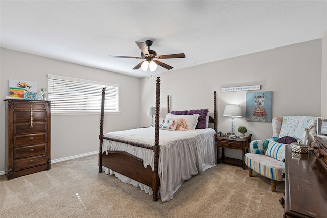 bedroom featuring light carpet and ceiling fan