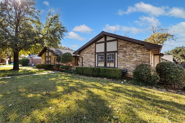 tudor home featuring a front lawn