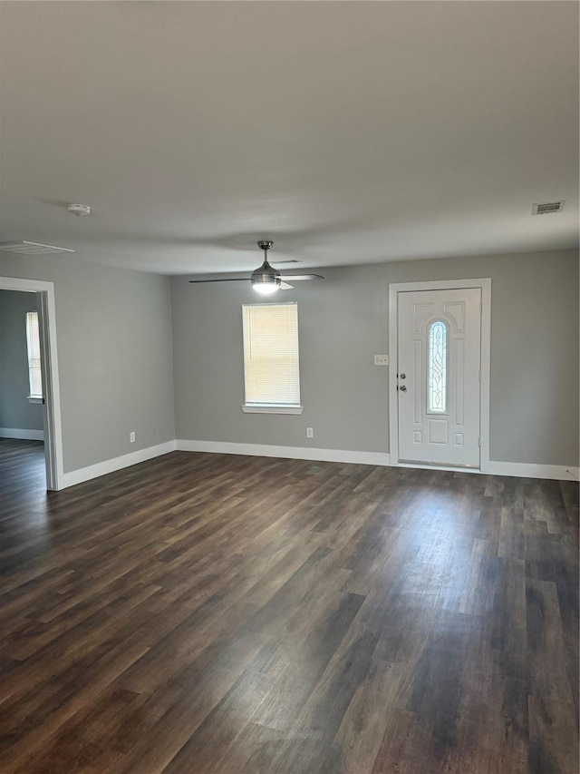 foyer with ceiling fan and dark wood-type flooring