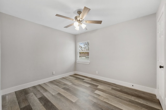 empty room with hardwood / wood-style flooring and ceiling fan