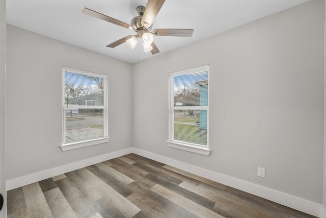 spare room with hardwood / wood-style floors and ceiling fan