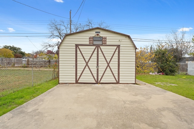 view of outbuilding with a yard