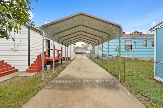 view of car parking with a carport and a yard