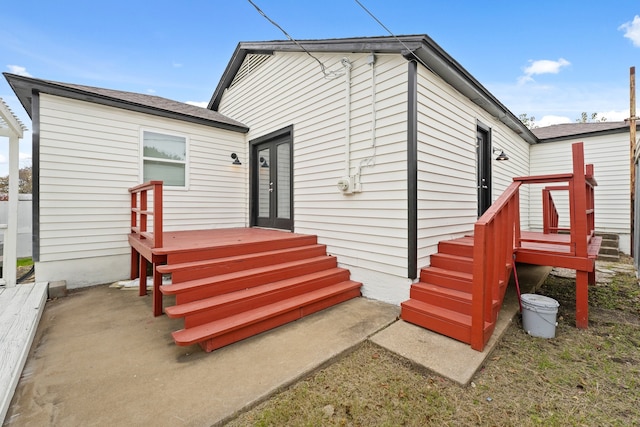 back of house featuring french doors and a deck