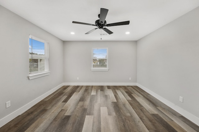 empty room with hardwood / wood-style flooring and ceiling fan