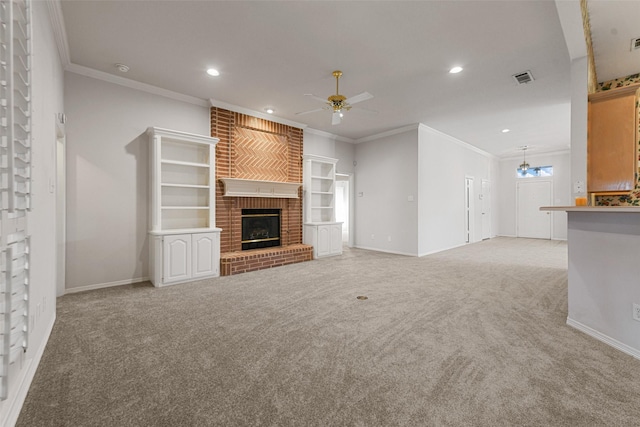 unfurnished living room with crown molding, light carpet, and a brick fireplace