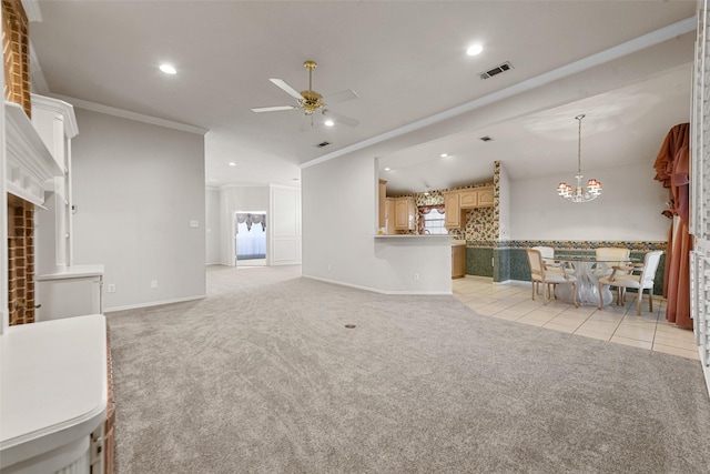 unfurnished living room featuring light tile patterned floors, ceiling fan with notable chandelier, and ornamental molding