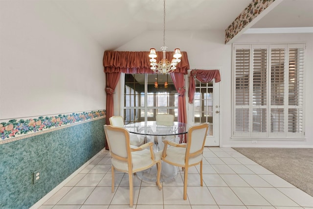 tiled dining space with a notable chandelier and vaulted ceiling