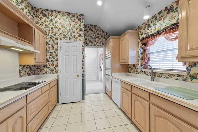 kitchen featuring light brown cabinets, light tile patterned floors, white appliances, and sink