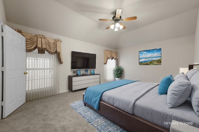 bedroom with ceiling fan, light carpet, and lofted ceiling