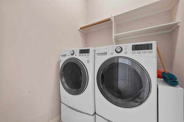 laundry room featuring washing machine and dryer