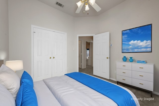 carpeted bedroom with a closet and ceiling fan