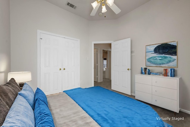 carpeted bedroom with a closet and ceiling fan