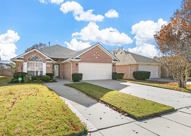 single story home featuring a front yard and a garage