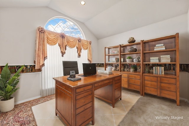 office space with light carpet and vaulted ceiling