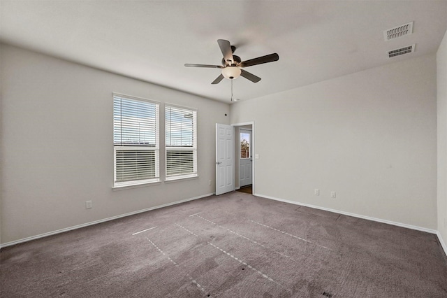 carpeted empty room featuring ceiling fan