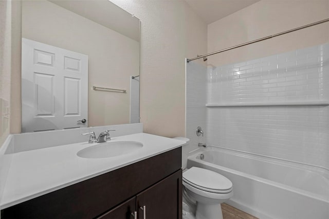 full bathroom featuring tile patterned floors, vanity, toilet, and bathtub / shower combination