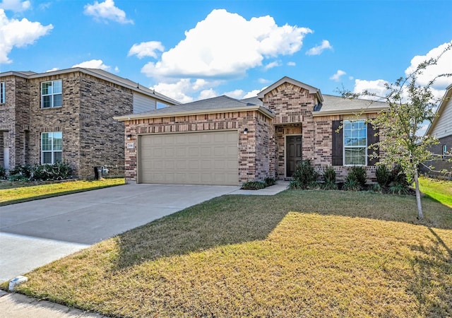 view of front of home featuring a front yard and a garage