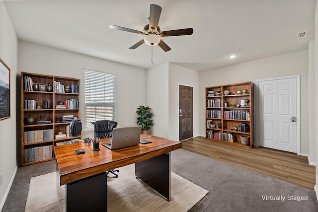 home office featuring ceiling fan and hardwood / wood-style flooring