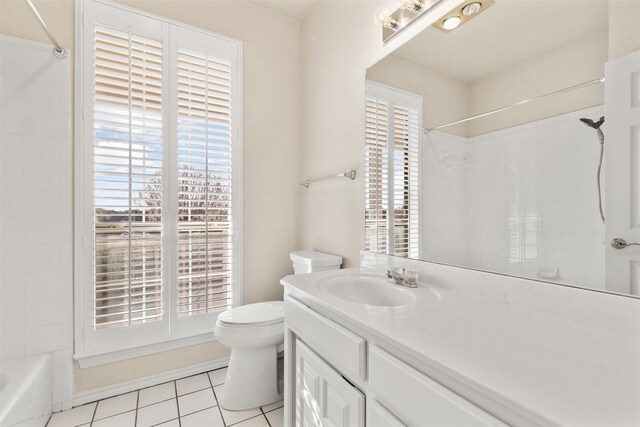 full bathroom with tile patterned floors, shower / washtub combination, vanity, and toilet